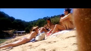 Four Topless Teens At The Beach