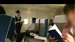 Japanese Stewardess Gives A Passenger A  During The Flight